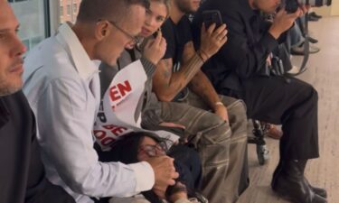Kolb was also seen covering protesters' mouths as they shouted slogans.