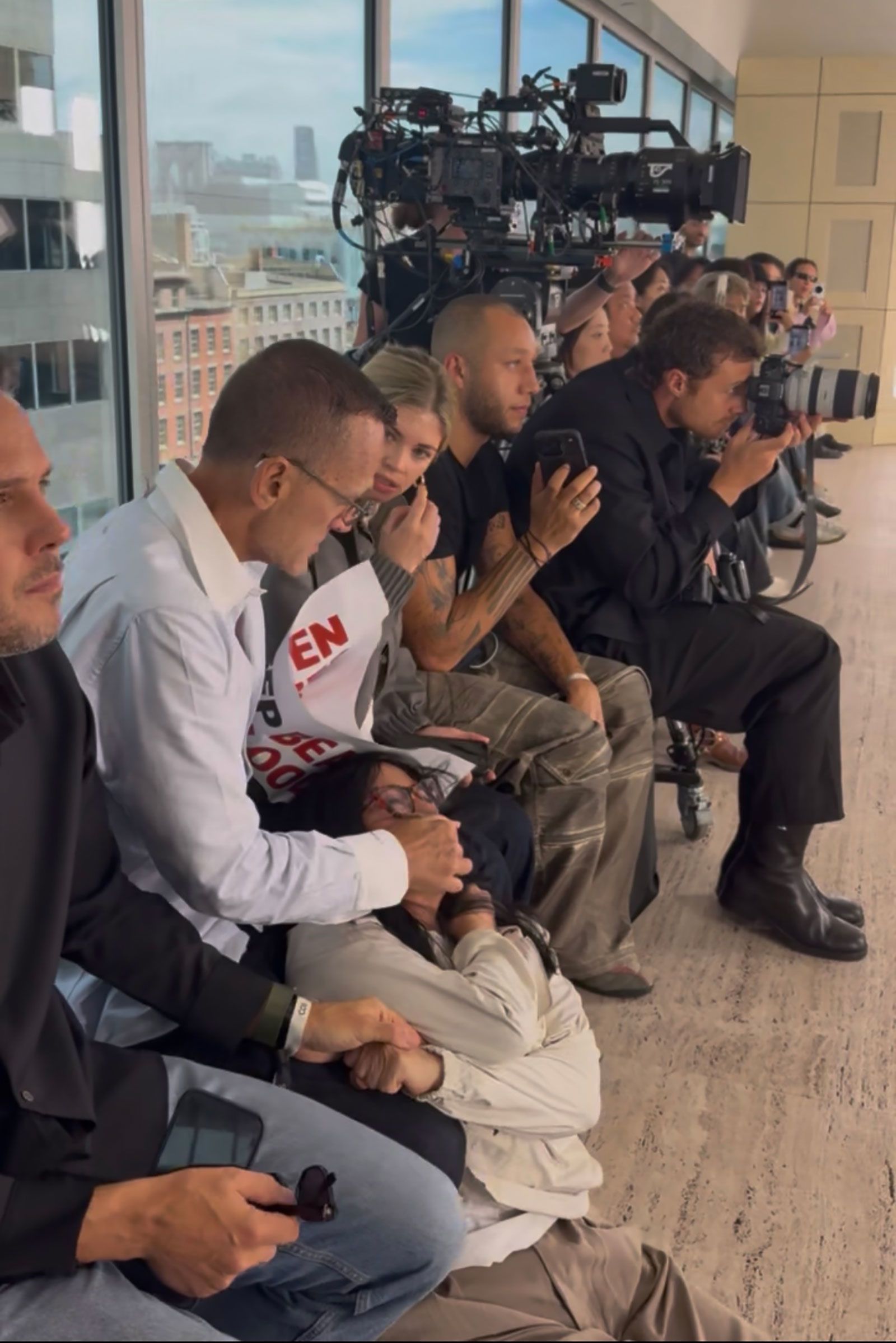 <i>PETA via CNN Newsource</i><br/>Kolb was also seen covering protesters' mouths as they shouted slogans.