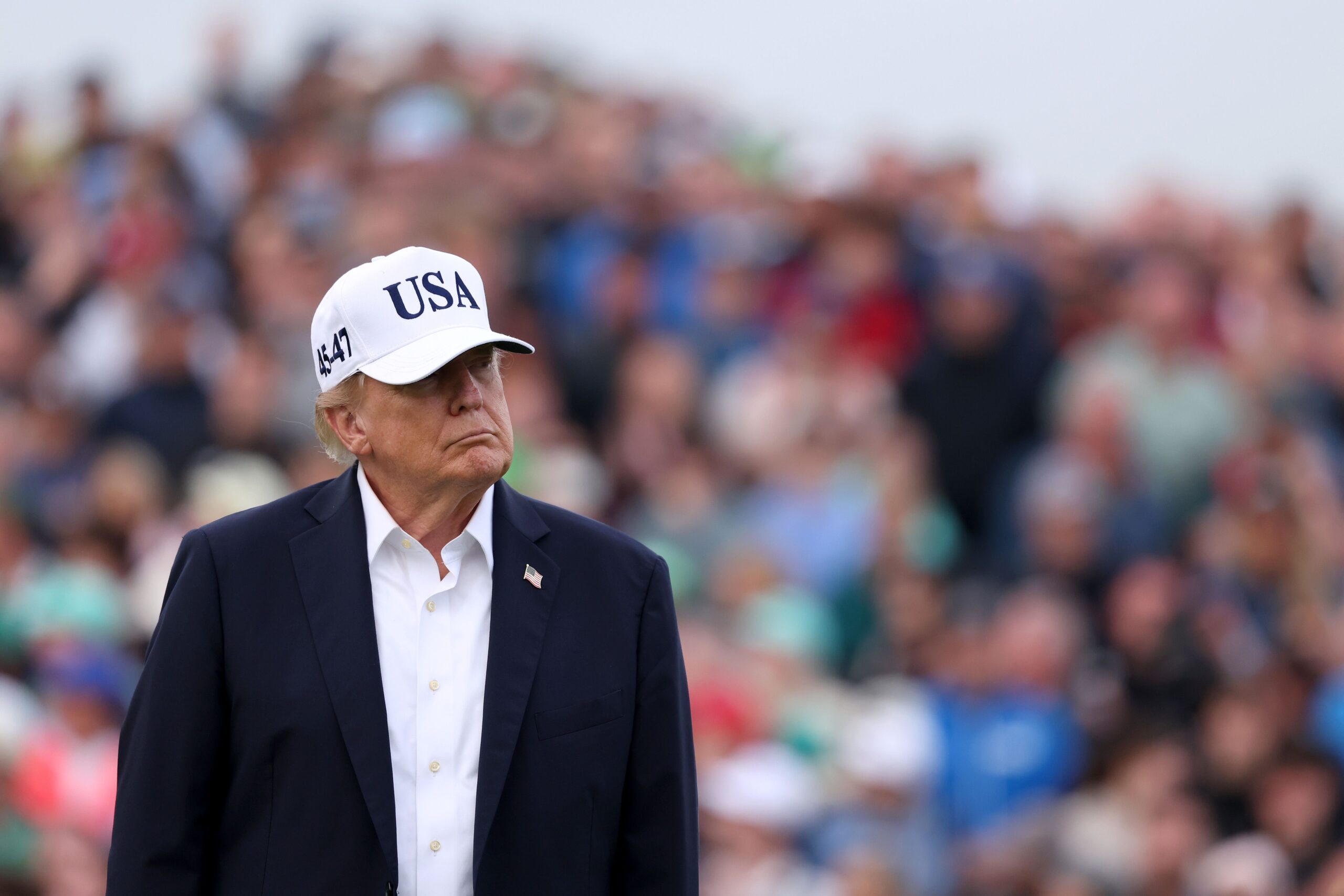 <i>Richard Heathcote/Getty Images via CNN Newsource</i><br/>President Donald Trump looks across the 18th green during the trophy presentation at the Amgen Irish Open at Trump International Golf Links in Doonbeg