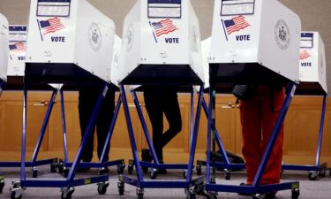 Voters fill out ballots at a polling station in New York on November 5