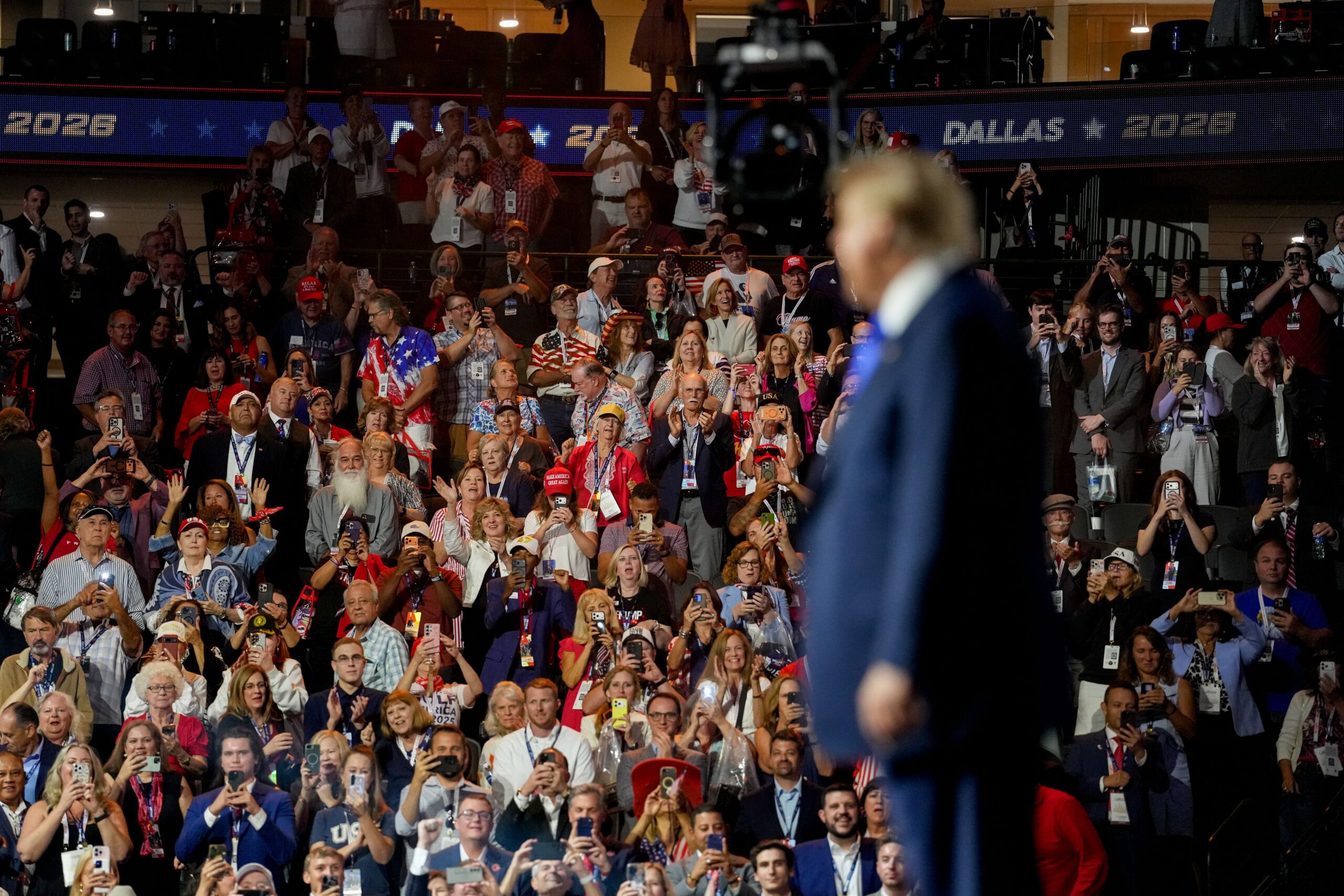 <i>Al Drago/Bloomberg/Getty Images via CNN Newsource</i><br/>Attendees cheers as President Donald Trump