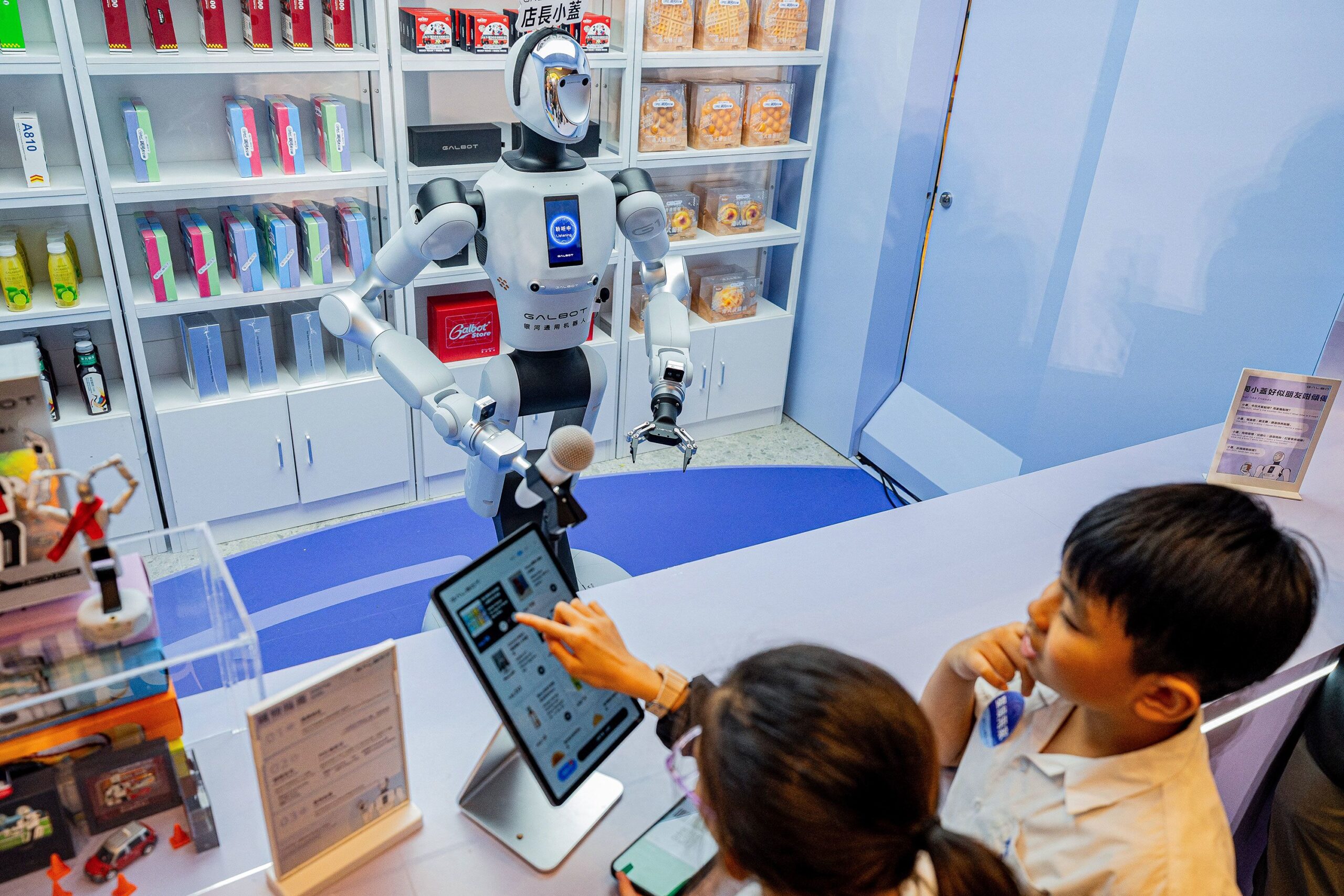 <i>Hector Retamal/AFP/Getty Images via CNN Newsource</i><br/>A humanoid robot is seen working with packages during the World Artificial Intelligence Conference in Shanghai