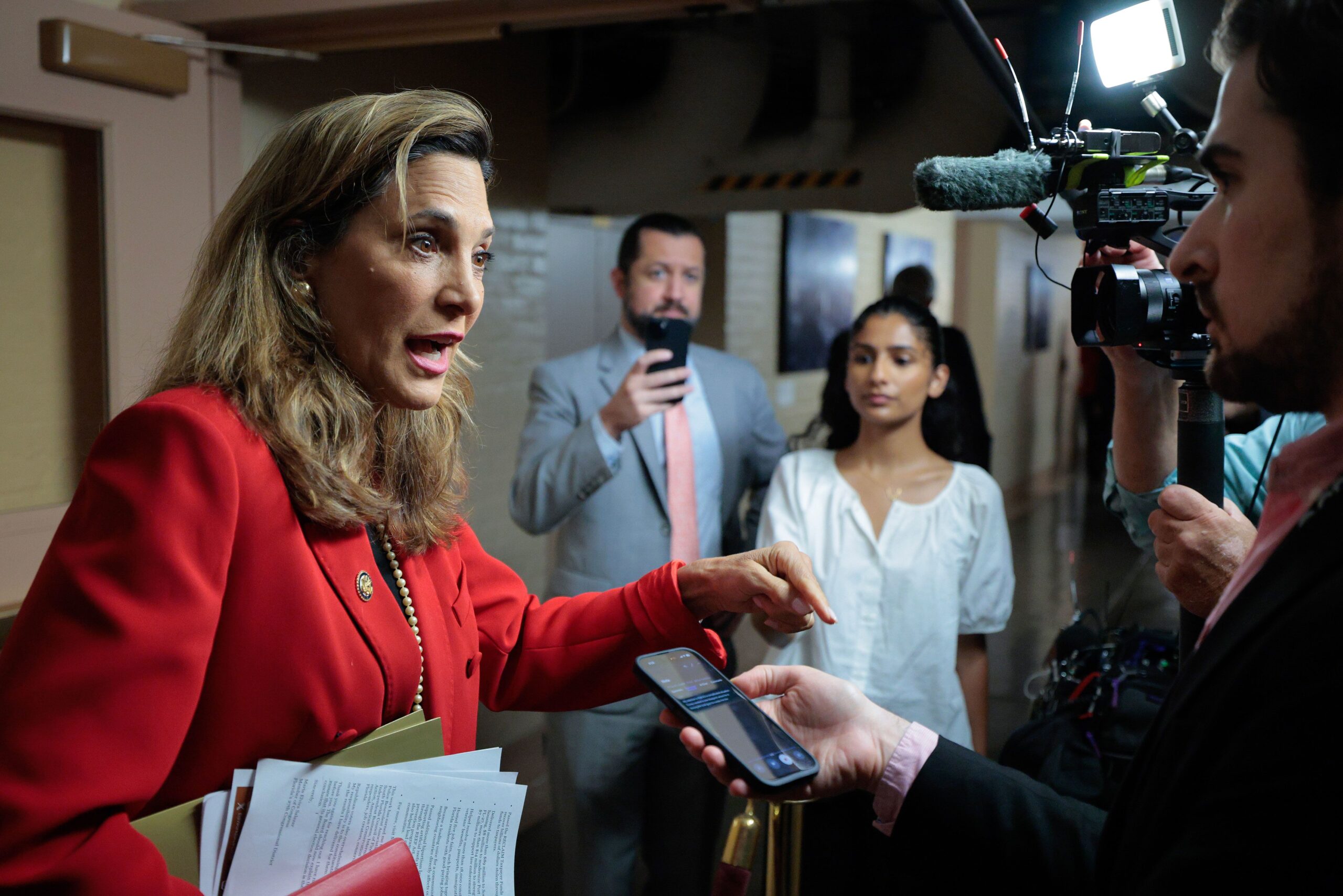 <i>Chip Somodevilla/Getty Images via CNN Newsource</i><br/>Rep. Maria Elvira Salazar talks to reporters following a House Republican conference in the basement of the US Capitol on September 1 in Washington