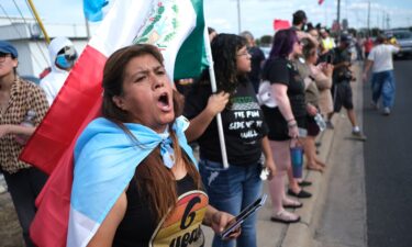 People protest where local authorities say a US Immigration and Customs Enforcement officer shot and wounded a man in Austin