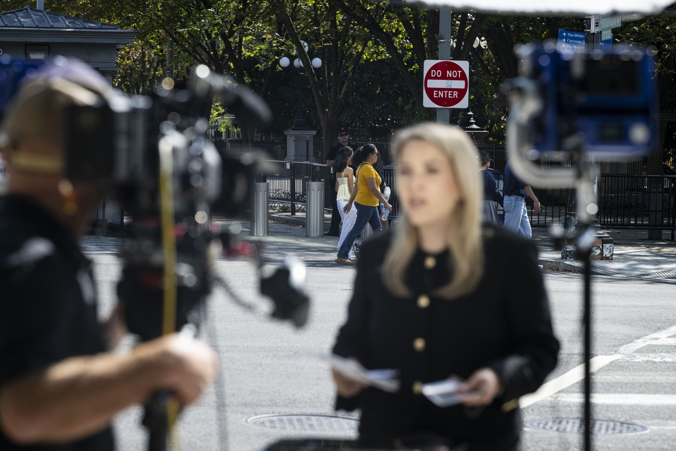 <i>Graeme Sloan/Getty Images via CNN Newsource</i><br/>The White House grounds are seen behind CNN senior White House reporter Betsy Klein after the network was denied entry on September 19