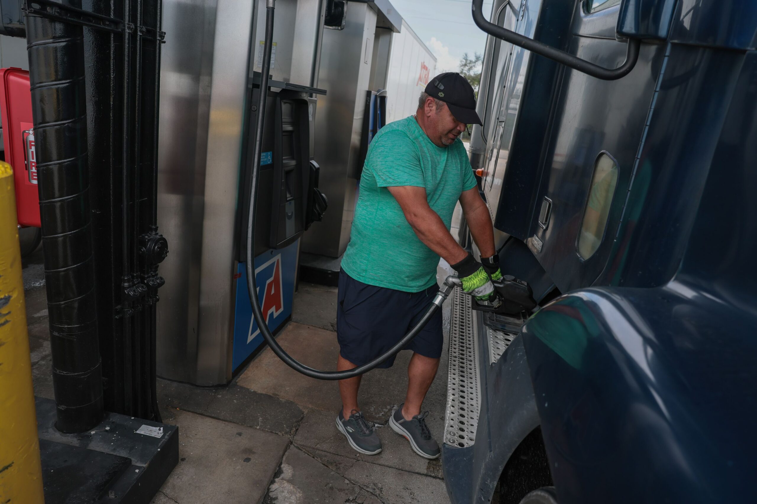 <i>Joe Raedle/Getty Images via CNN Newsource</i><br/>A person pumps diesel fuel into his tractor-trailer at a truck stop on September 11