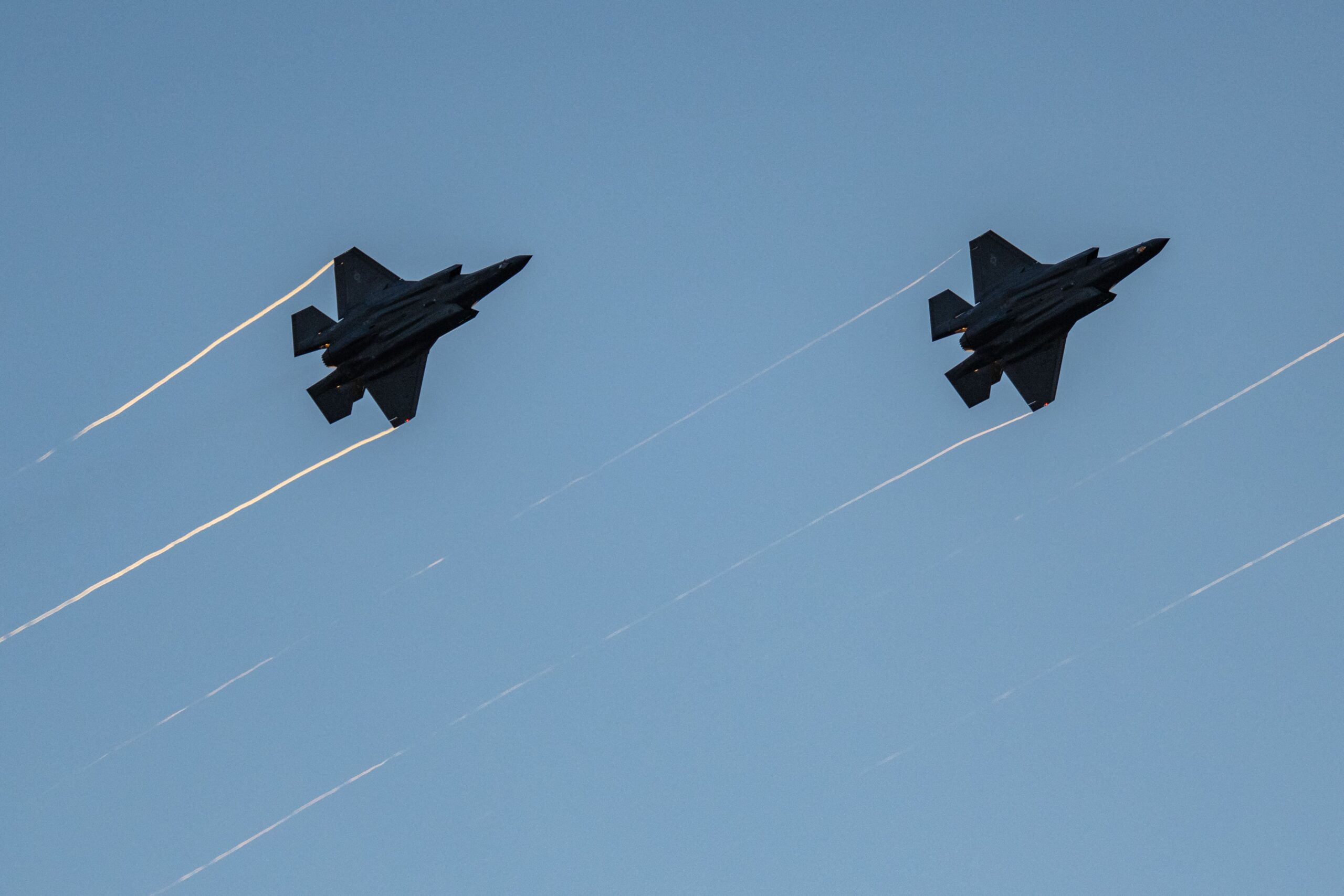 <i>Ken Cedeno/AFP/Getty Images via CNN Newsource</i><br/>F-35s fly in formation with their afterburners during a kick-off celebration for the 