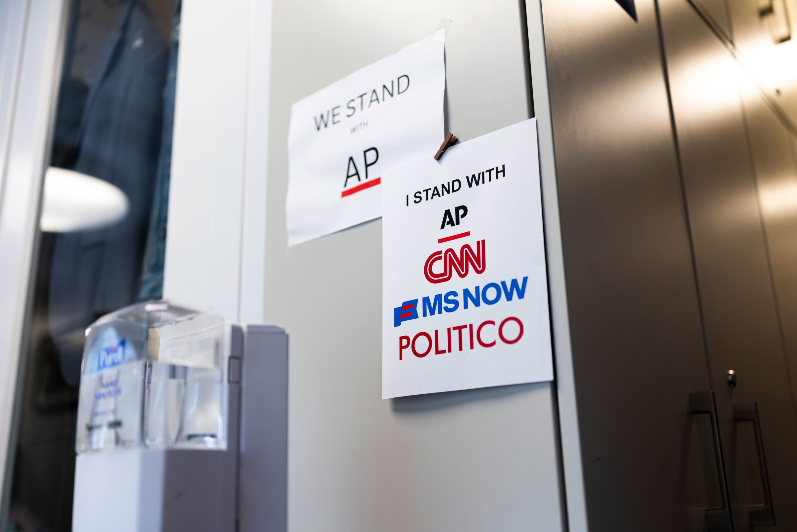 <i>Finn Gomez/Getty Images via CNN Newsource</i><br/>Signs of support for AP