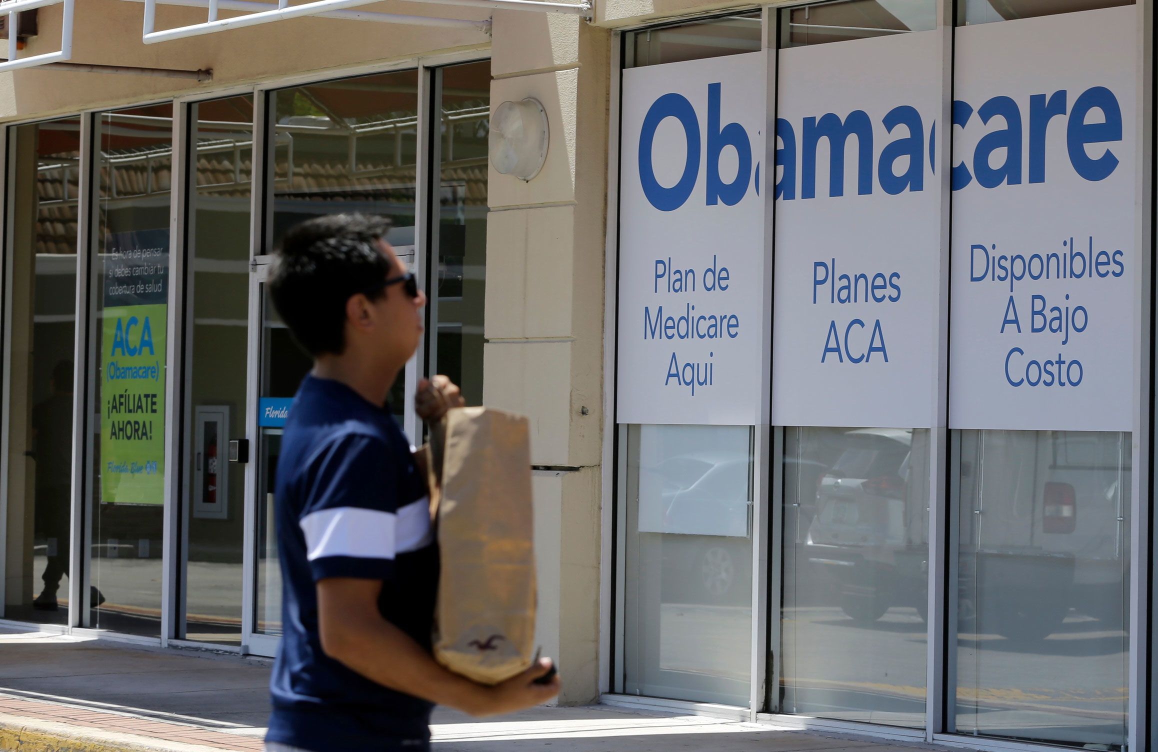 <i>Alan Diaz/AP via CNN Newsource</i><br/>A healthcare insurance office in Hialeah