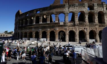 Tourists gather outside the Colosseum in Rome on Wednesday