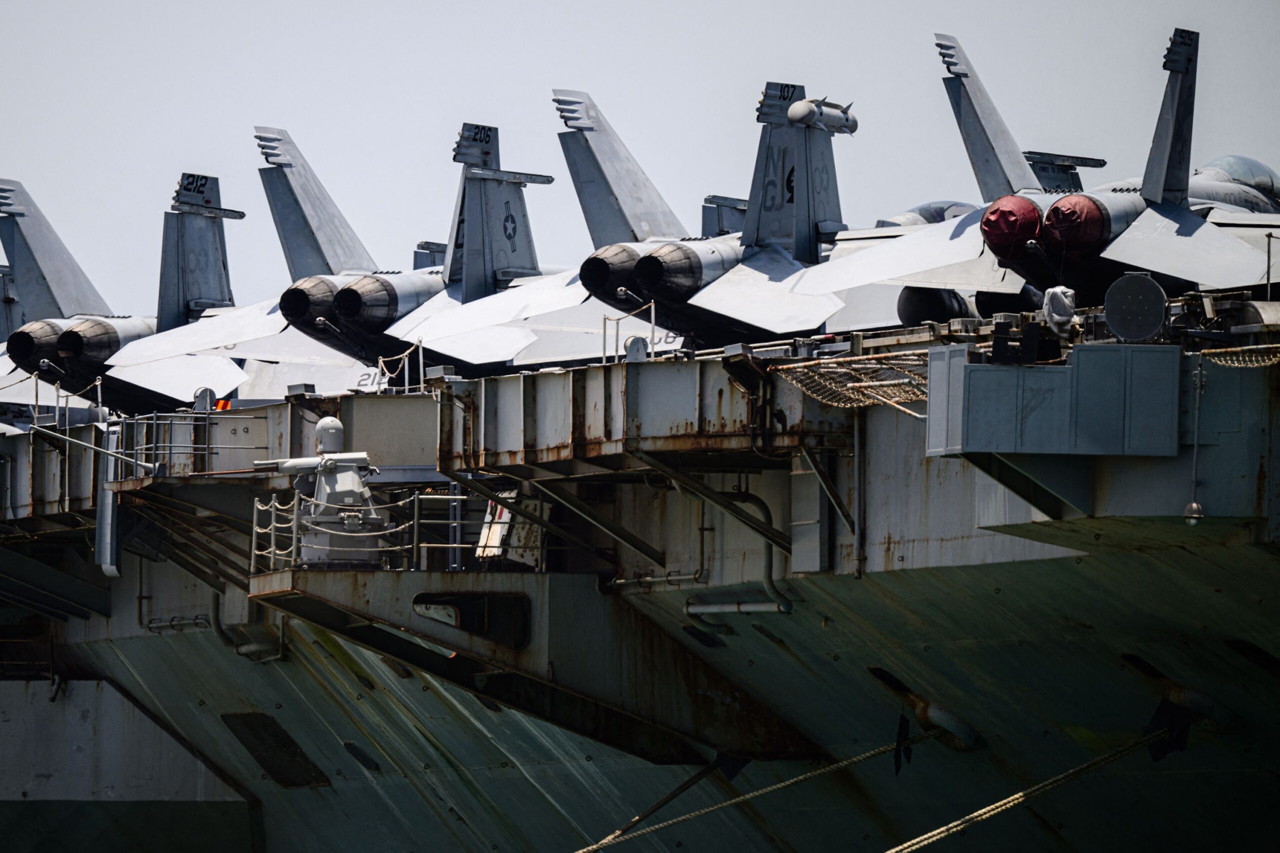 <i>Anthony Wallace/AFP/Getty Images via CNN Newsource</i><br/>Aircrafts are seen on the flight deck of USS Abraham Lincoln while docked at Laem Chabang Port