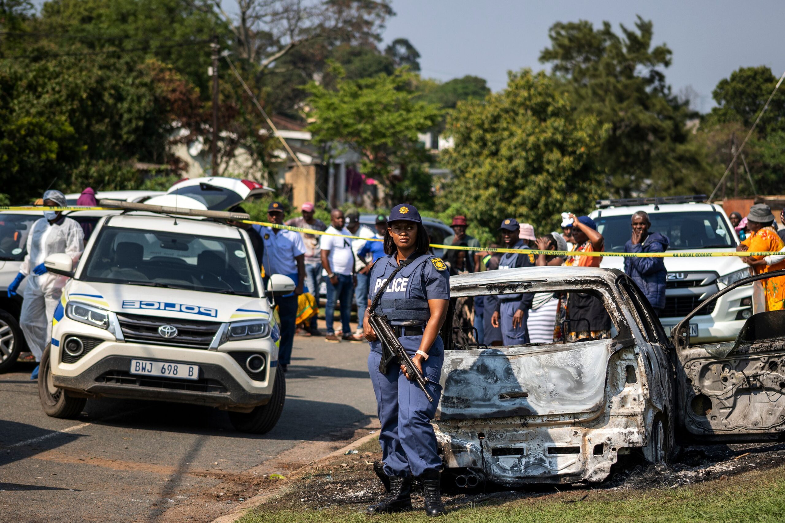 <i>AP via CNN Newsource</i><br/>A police officer stands at the scene of a mass shooting at a house party in KwaMakhutha township south of the city of Durban