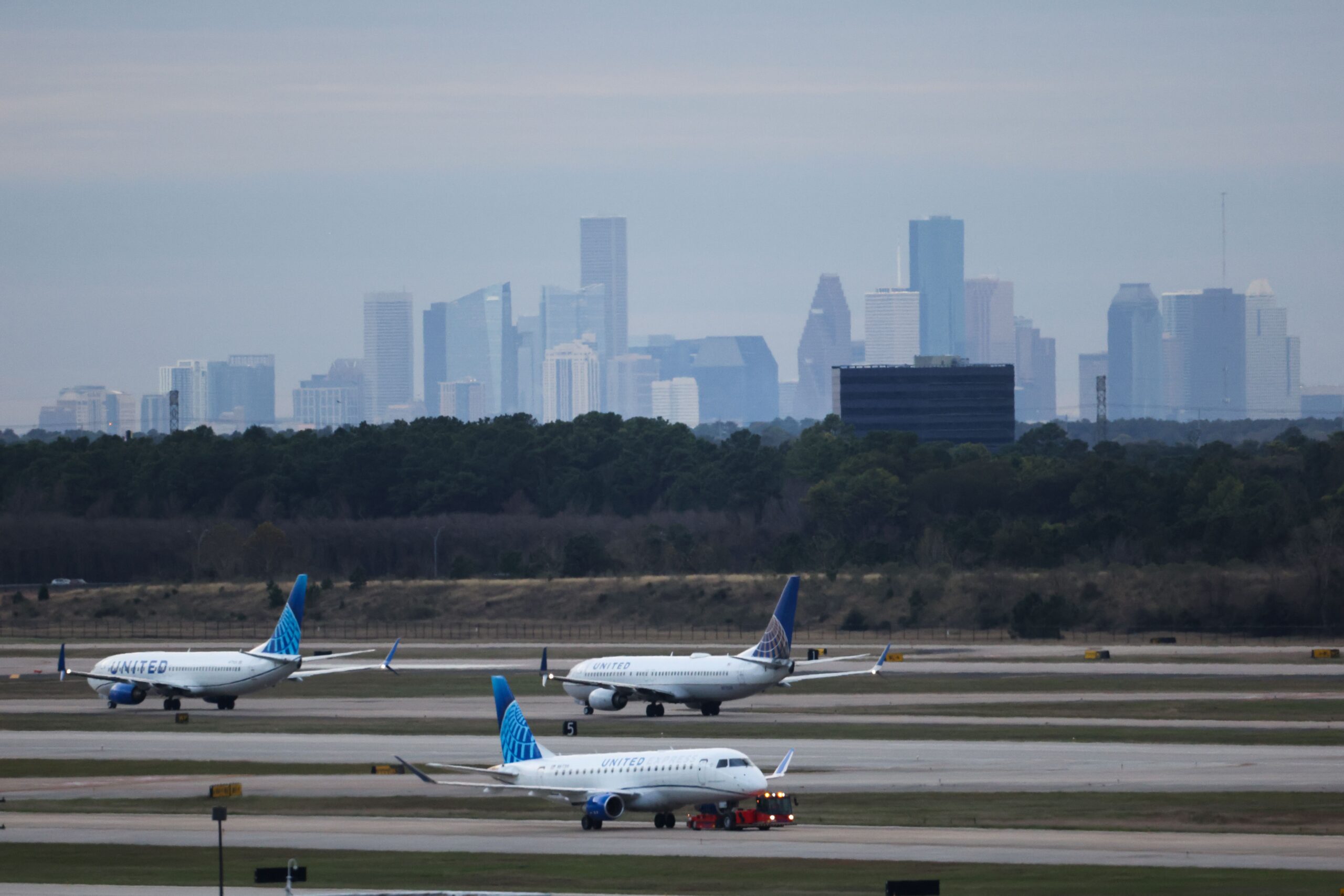 <i>Reginald Mathalone/NurPhoto/Getty Images via CNN Newsource</i><br/>Planes line up to depart from George Bush Intercontinental Airport (IAH) in Houston