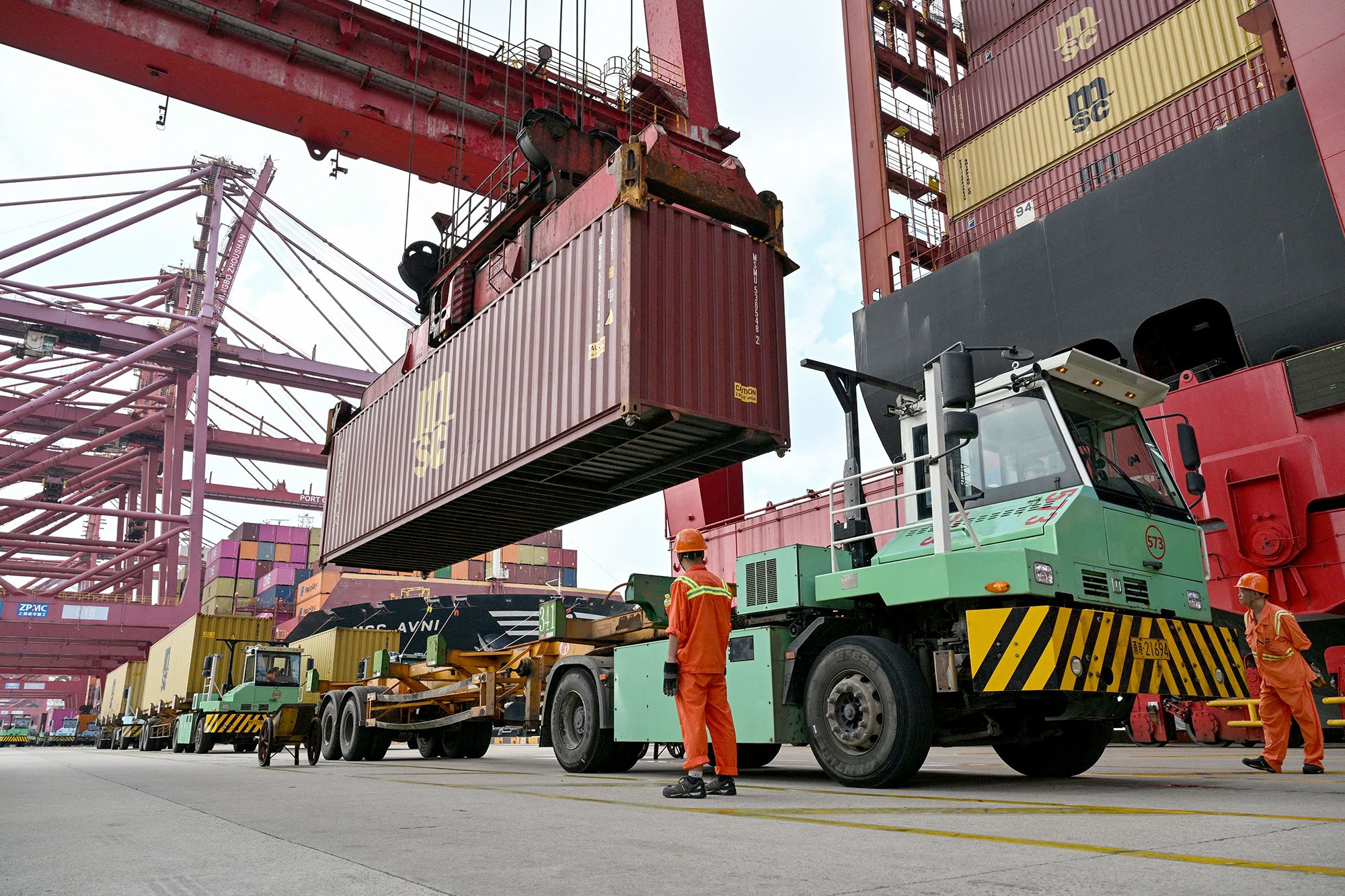 <i>Hector Ramal/AFP/Getty Images via CNN Newsource</i><br/>Cranes load containers onto a ship at the Port of Ningbo-Zhoushan in Ningbo