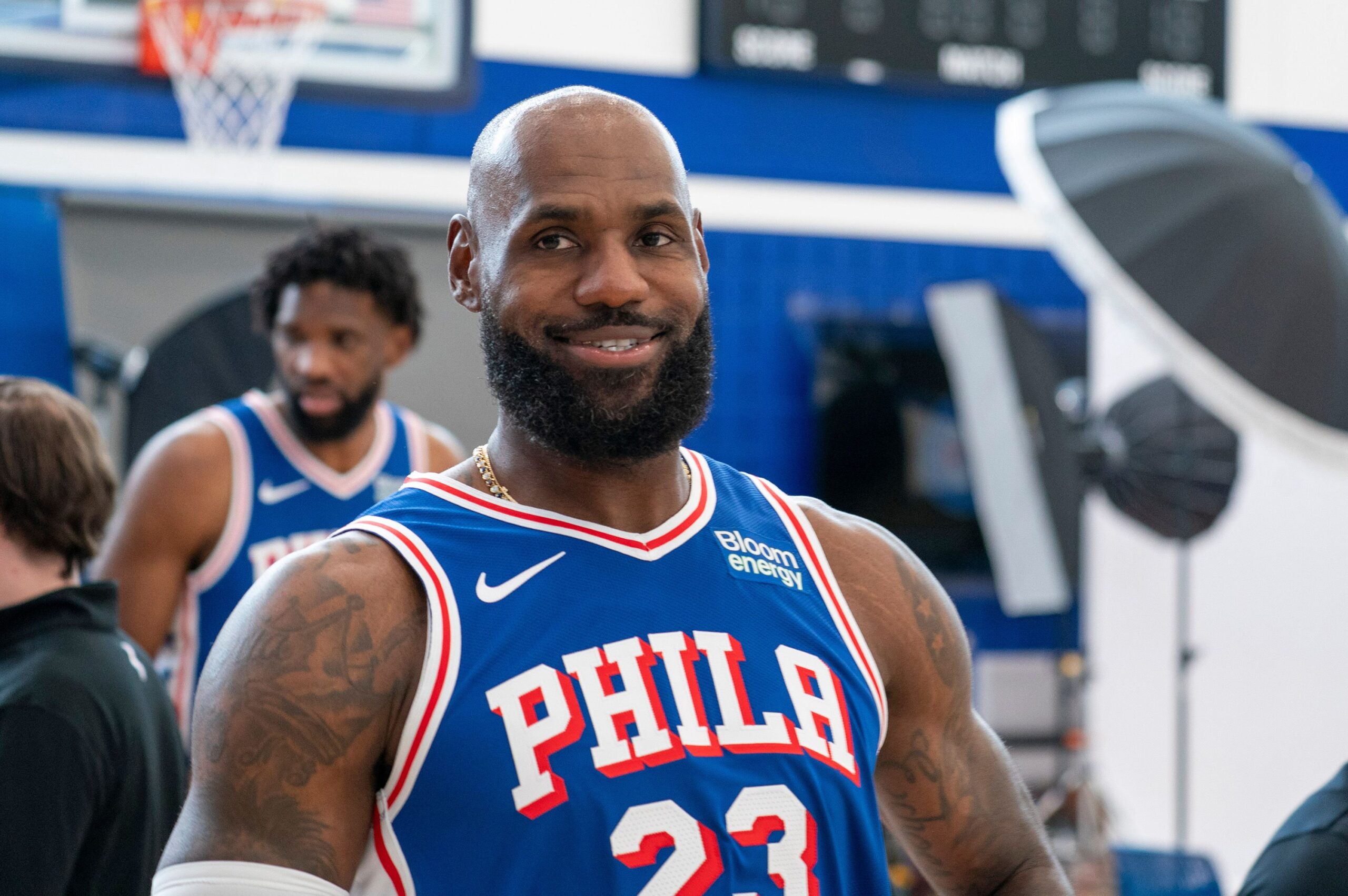 <i>Chris Szagola/AP via CNN Newsource</i><br/>Philadelphia 76ers' LeBron James reacts as he goes between stations during the NBA basketball team's media day in Camden