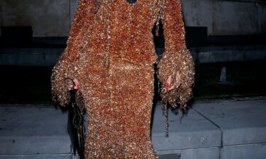 Rosalía stepped out for a casual photo op outside of the Ritz Carlton wearing a demure gray cardigan
