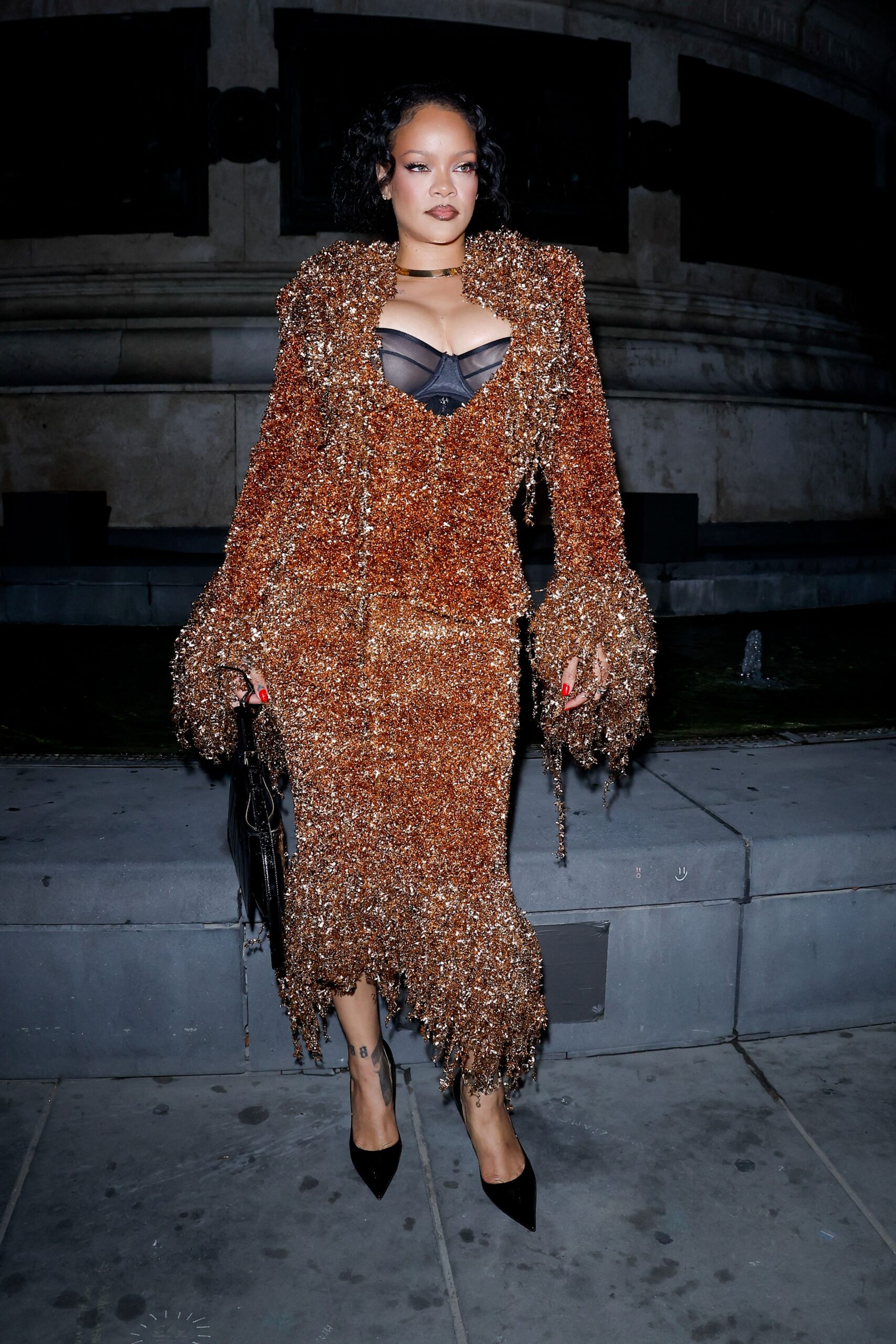 <i>Pierre Suu/GC Images/Getty Images via CNN Newsource</i><br/>Rosalía stepped out for a casual photo op outside of the Ritz Carlton wearing a demure gray cardigan