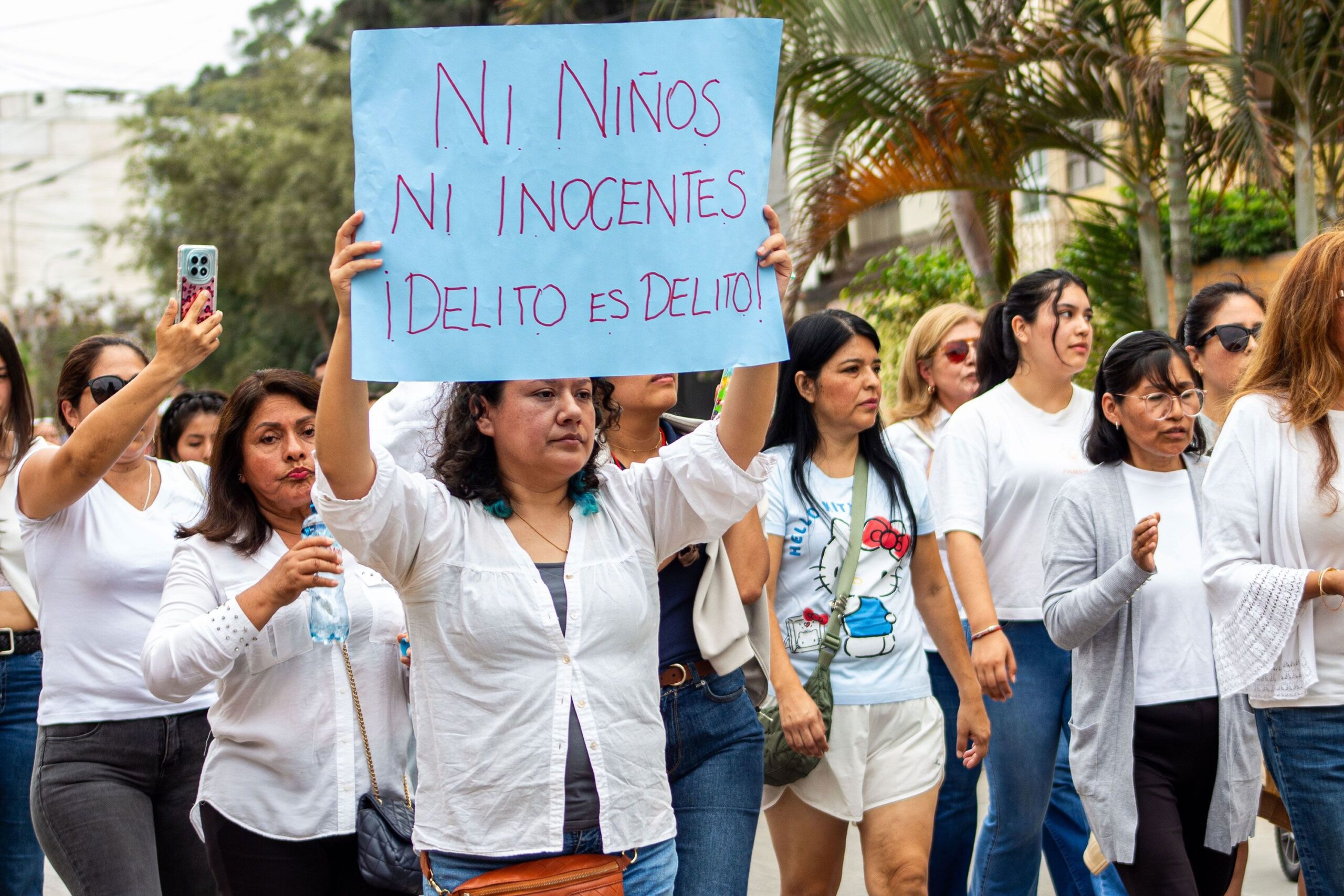 <i>ORuby Farah/JNA Press/Sipa USA via CNN Newsource</i><br/>Residents and parents gather outside the Liceo Naval Almirante Guise school in San Borja