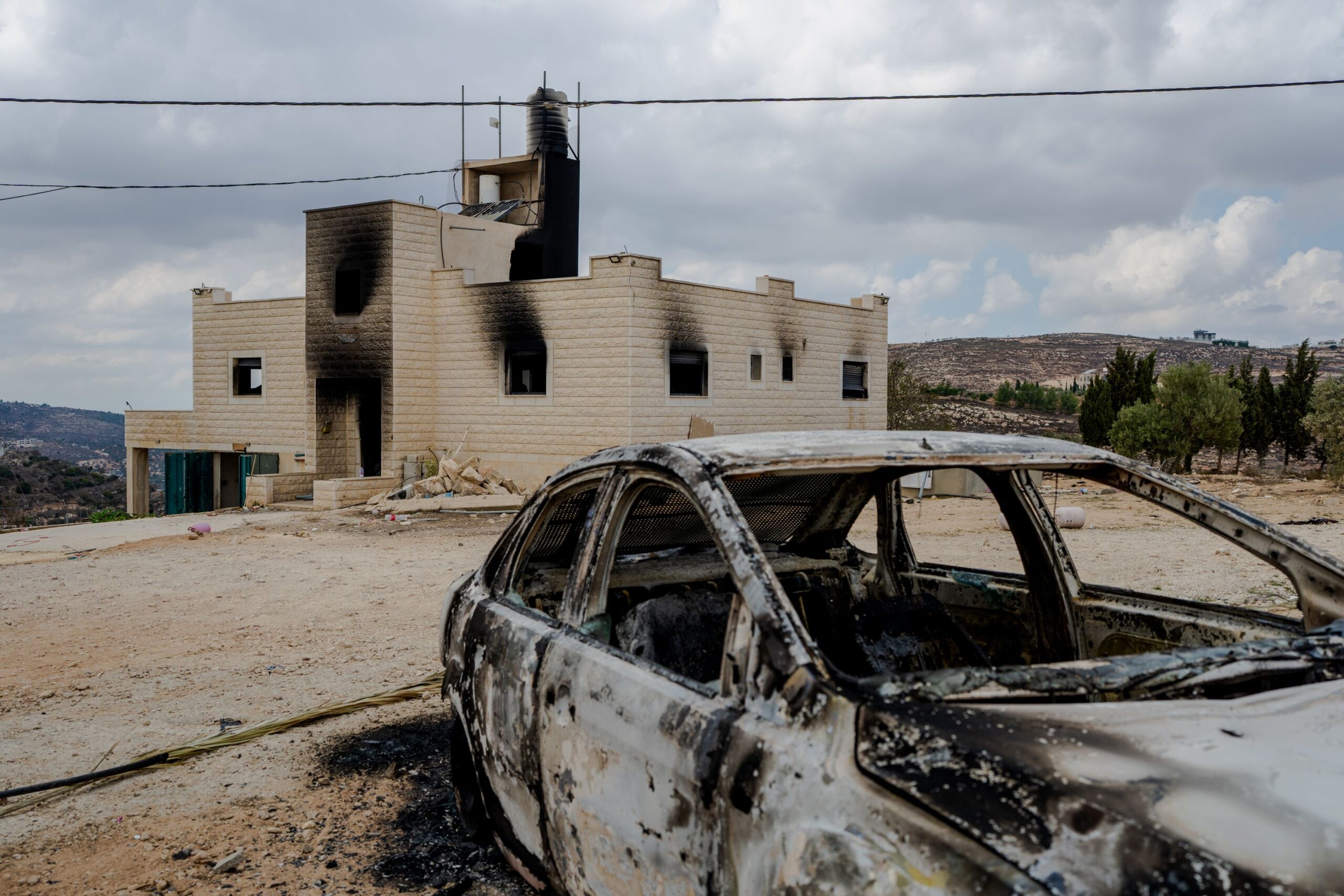 <i>Erik Marmor/Getty Images via CNN Newsource</i><br/>A destroyed car sits outside a burnt house after Israeli settlers attacked the Tubasi family and Israeli security forces who were escorting them back to their home in Jalud.