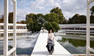 Models floated above a misty circular pond at Dior.