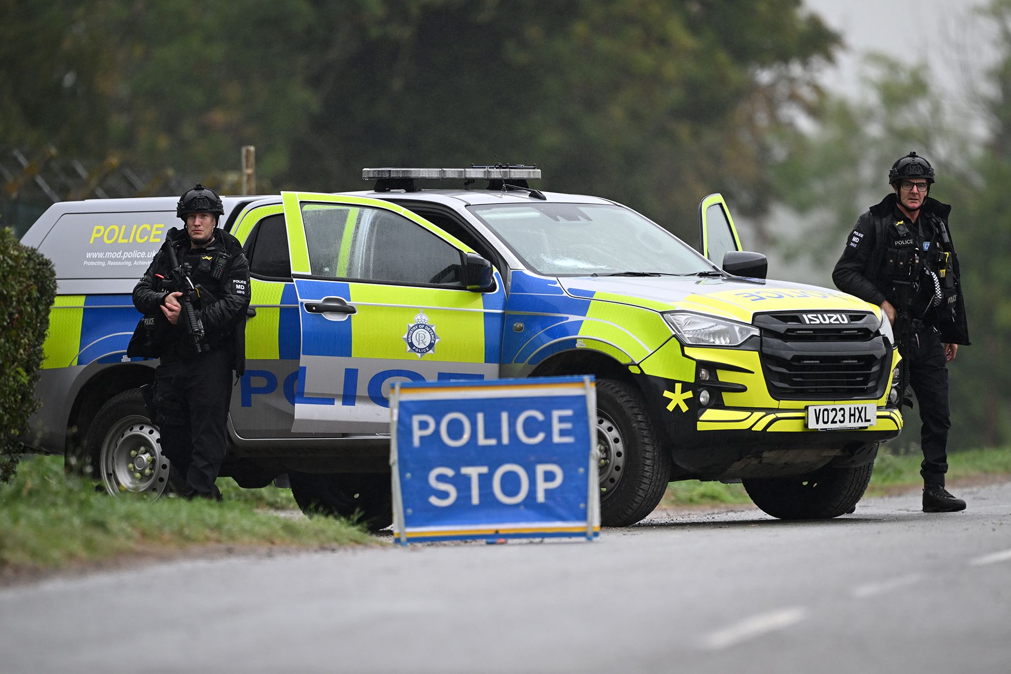 <i>Leon Neal/Getty Images via CNN Newsource</i><br/>Armed police maintain road blocks and security checks around RAF Fairford on September 27.