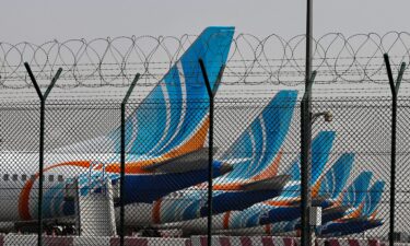 FlyDubai airline planes are parked on the tarmac at Dubai International Airport in Dubai on March 2