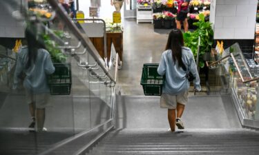 People shop for groceries at a supermarket in New York on August 25.