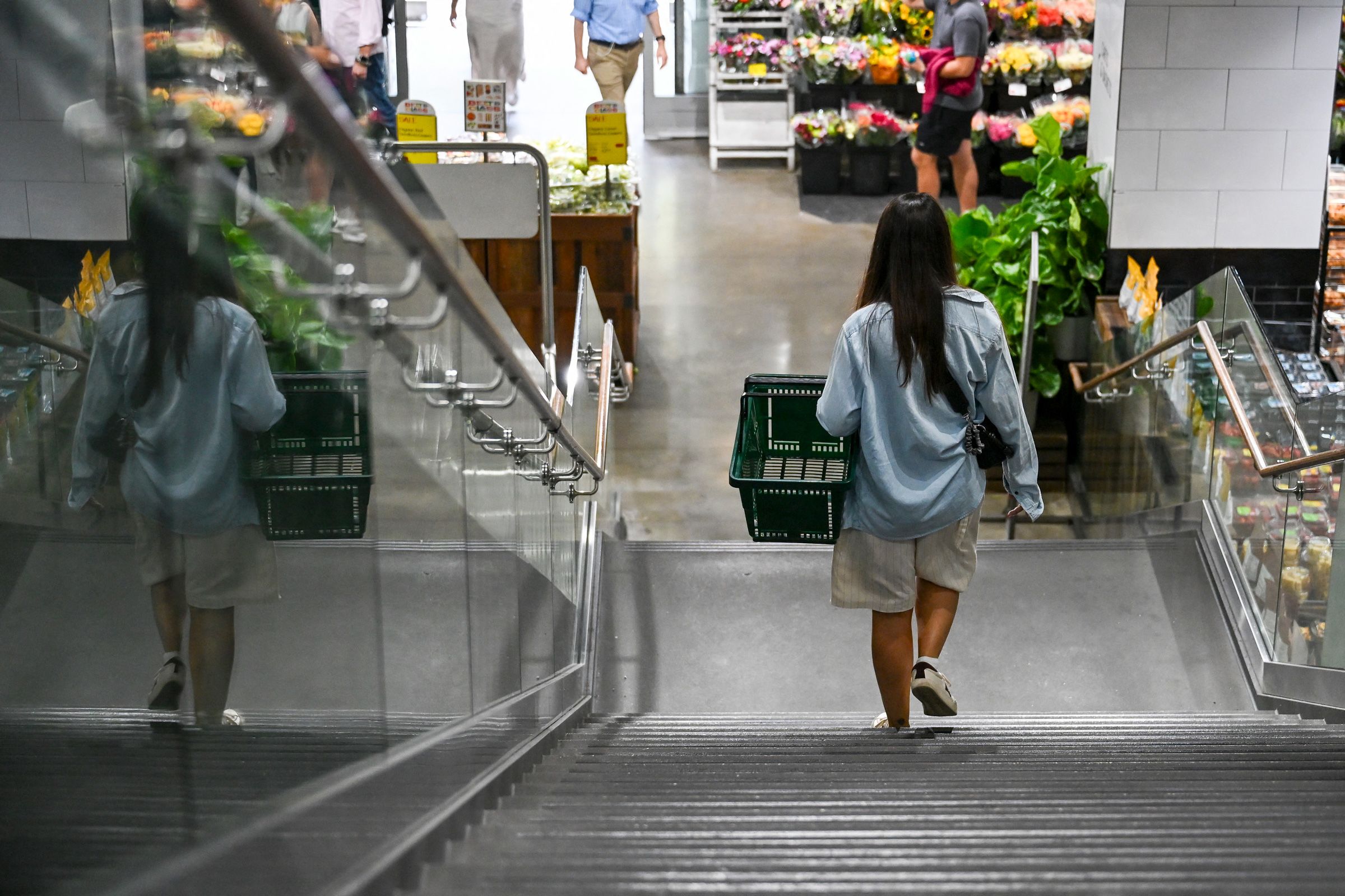 <i>Angela Weiss/AFP/Getty Images via CNN Newsource</i><br/>People shop for groceries at a supermarket in New York on August 25.