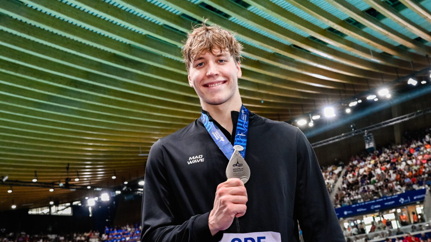 Egor Kornev of Neutral Athletes B shows the silver medal after competing in the Men's 50m Freestyle Final during the European Aquatics Championships at the Olympic Aquatic Center in Paris (France)