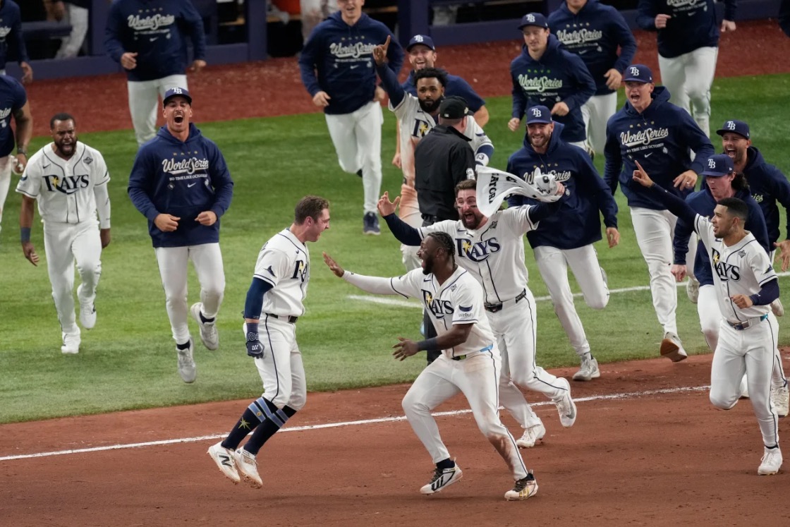 <i>Ashley Landis/AP via CNN Newsource</i><br/>Tampa Bay's Chandler Simpson celebrates his hit in the 12th inning.