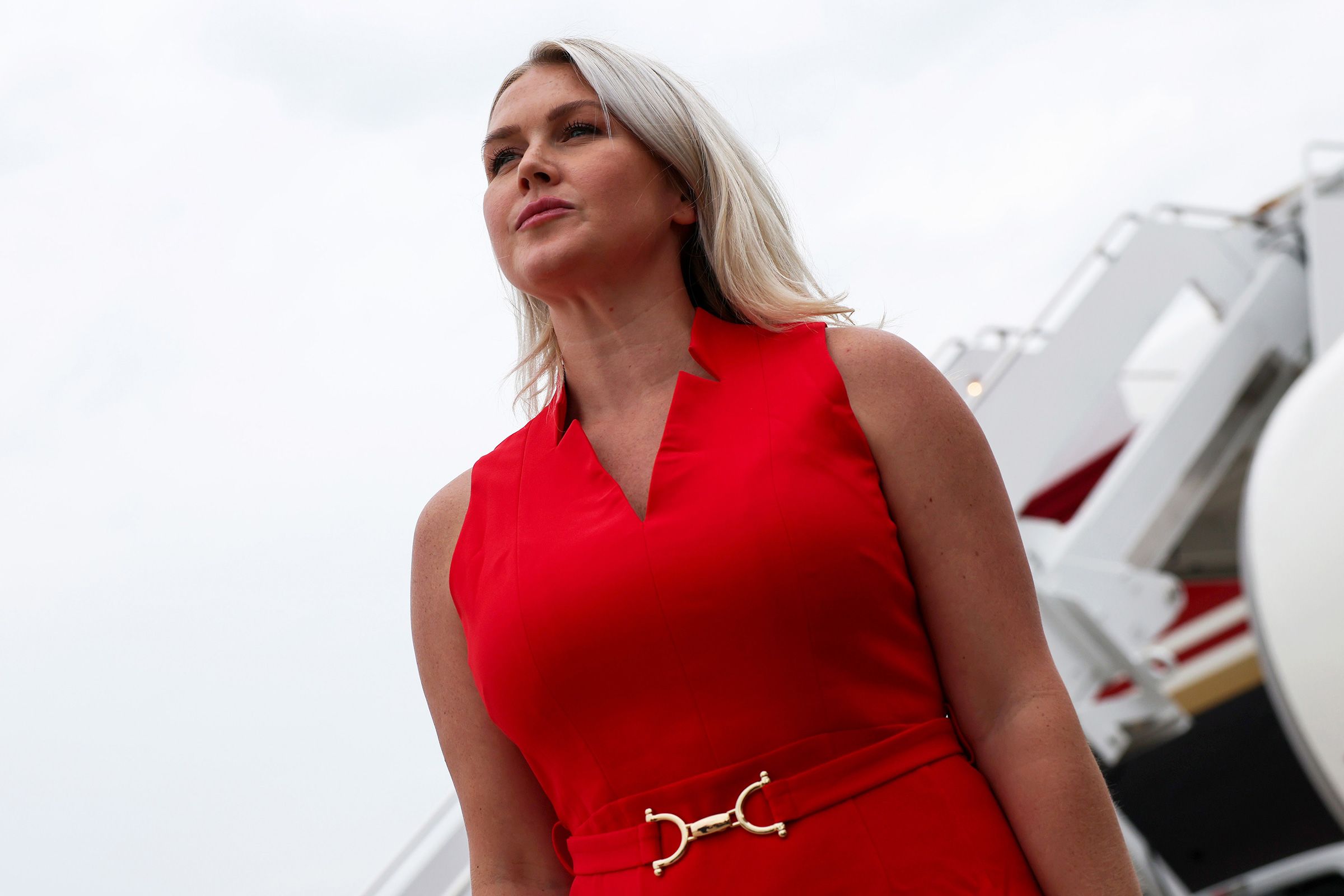 Karoline Leavitt, then the White House press secretary, listens as President Donald Trump speaks to reporters at Joint Base Andrews, Maryland, on August 14.