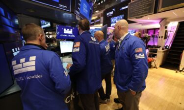 Traders work on the floor of the New York Stock Exchange at the opening bell in New York on Monday.