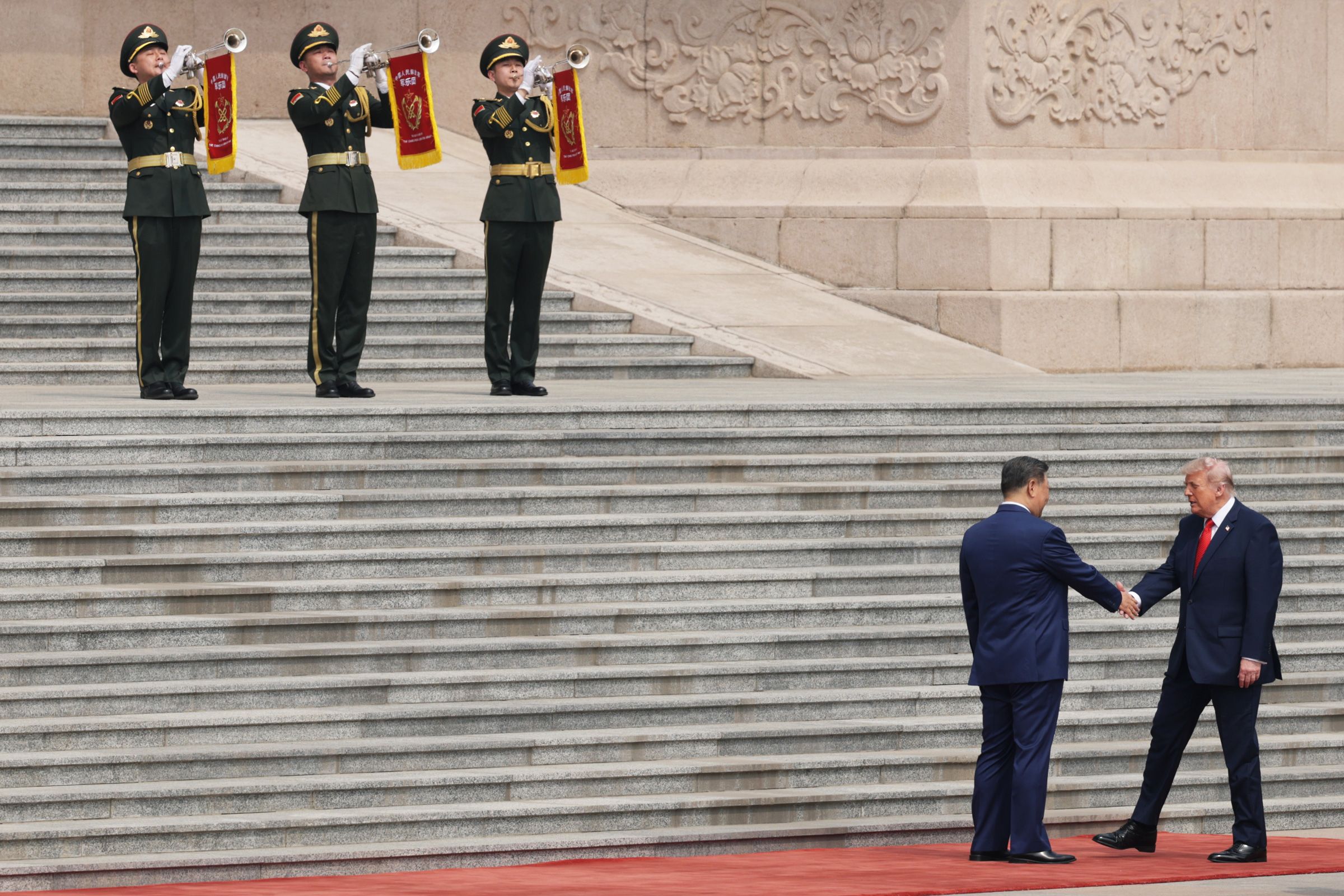 <i>Alex Wong/Getty Images via CNN Newsource</i><br/>President Donald Trump is greeted by Chinese President Xi Jinping during a welcome ceremony at the Great Hall of the People on May 14 in Beijing.