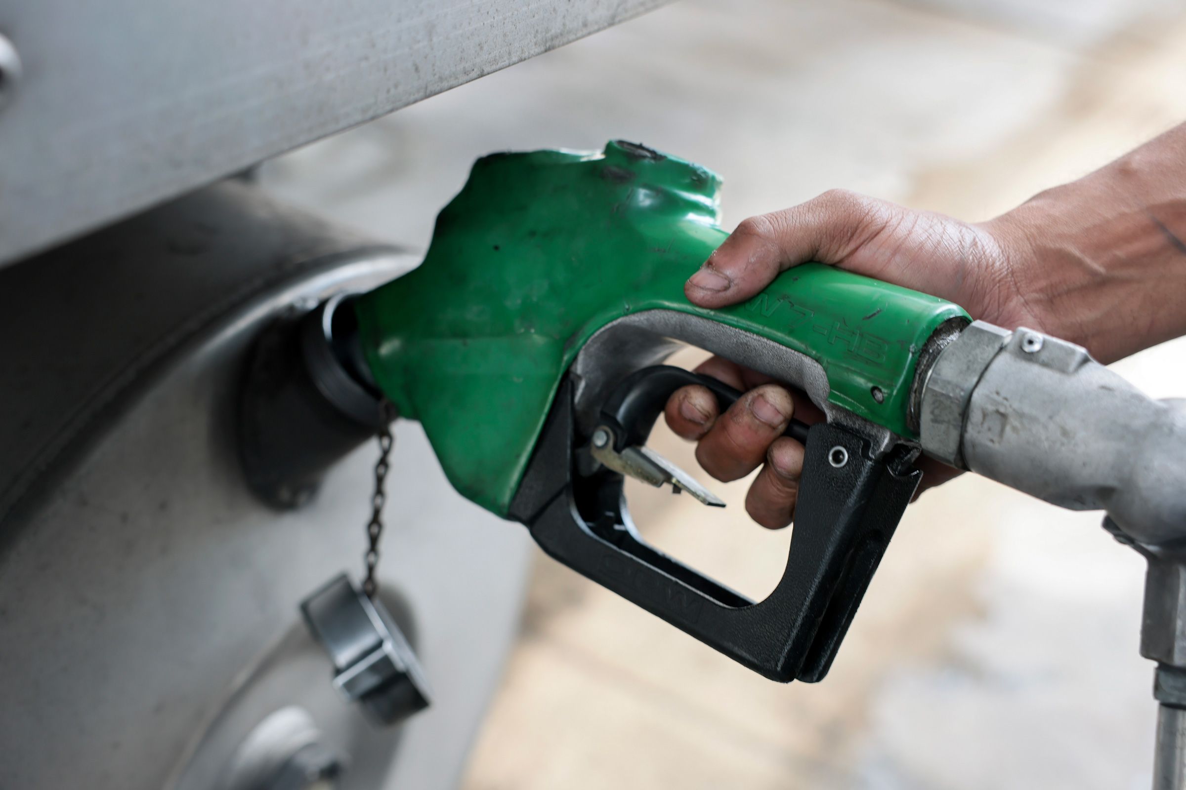 <i>Joe Raedle/Getty Images via CNN Newsource</i><br/>A person pumps diesel fuel into his tractor-trailer at a truck stop on September 11 in Miami.