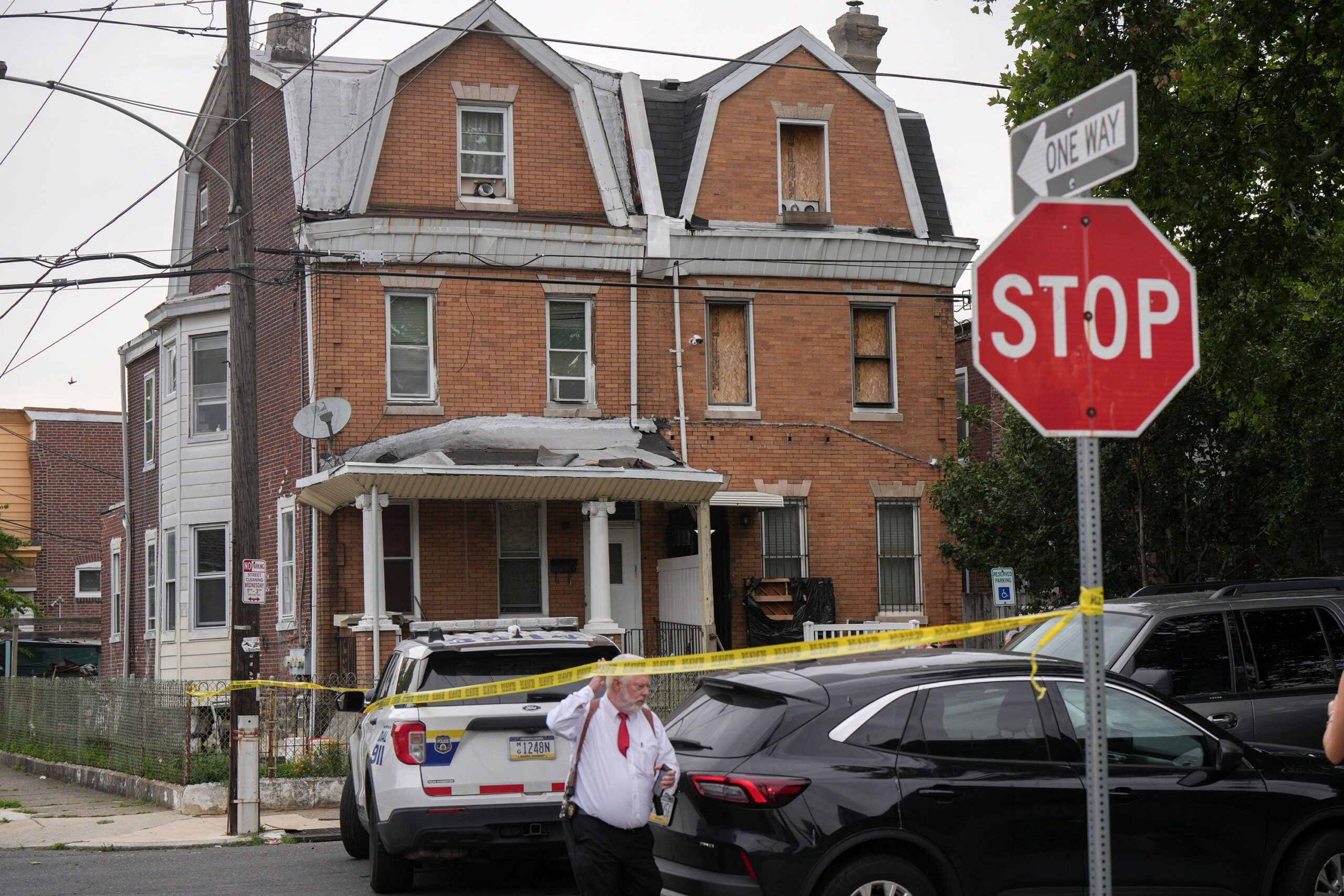 <i>Kyle Mazza/Sipa/AP via CNN Newsource</i><br/>A law enforcement officer carries evidence bags