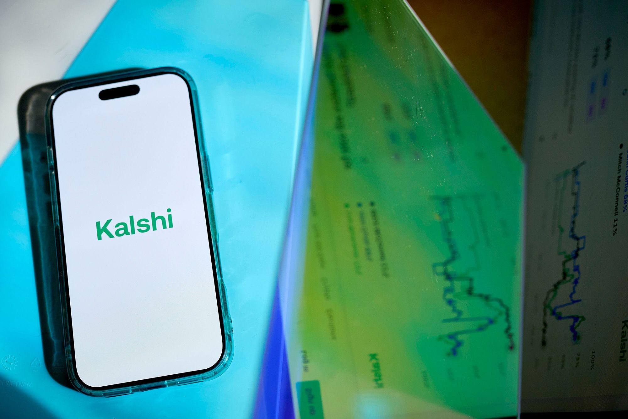 <i>Gabby Jones/Bloomberg/Getty Images via CNN Newsource</i><br/>The Kalshi logo arranged on a smartphone in New York