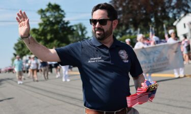 Rep. Mike Lawler walks in a July 4 parade in Tappan