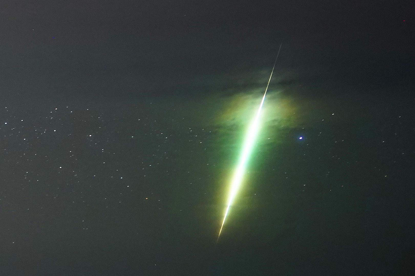 <i>Owen Humphreys/PA Images/Getty Images via CNN Newsource</i><br/>A meteor streaks across the sky during the Draconids over the county of Northumberland in England in October 2021.