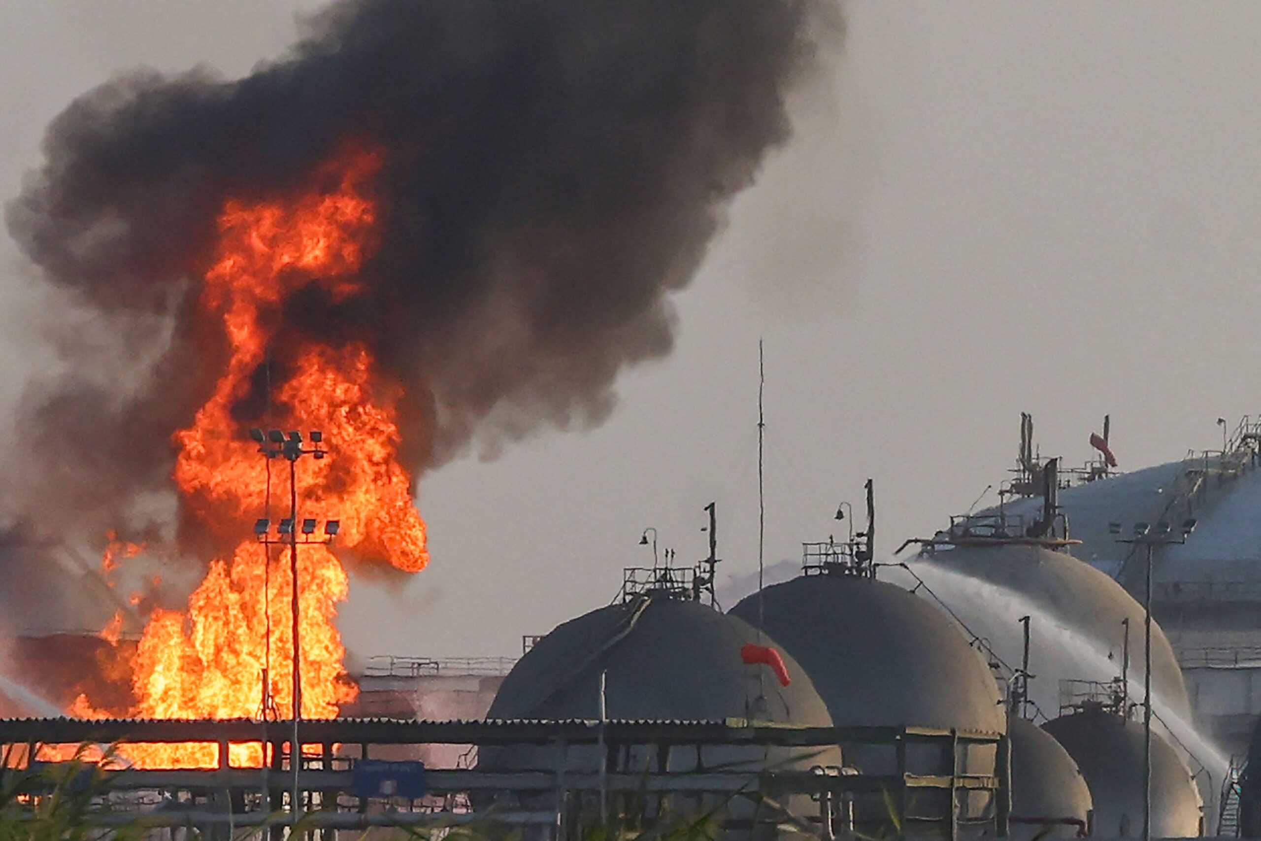 <i>AFP/Getty Images via CNN Newsource</i><br/>Flames burn at a facility belonging to Saudi oil giant Aramco