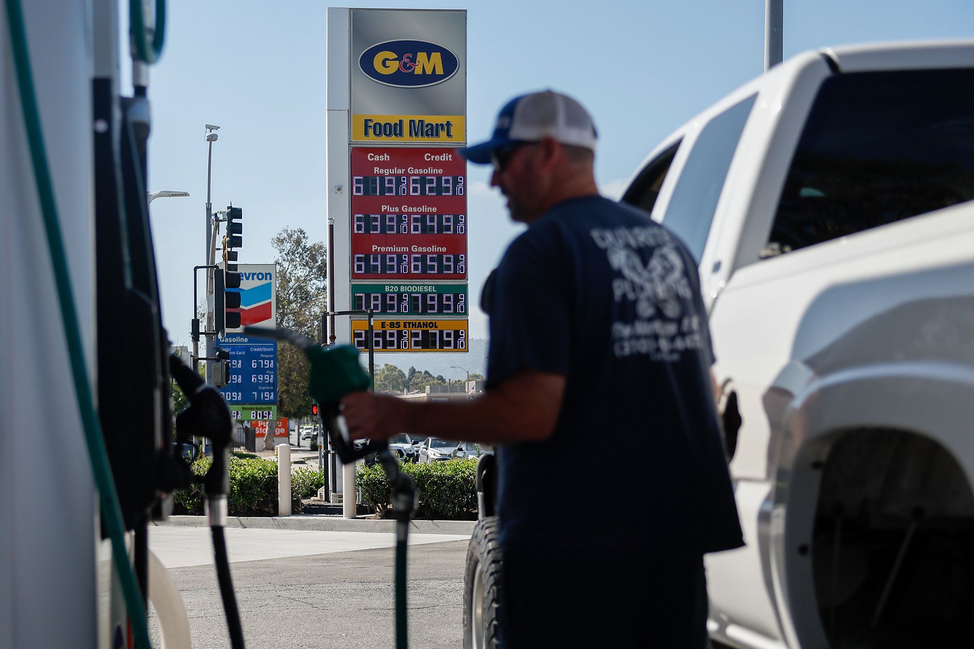 <i>Caroline Brehman/Bloomberg/Getty Images via CNN Newsource</i><br/>A sign displays the prices of unleaded gasoline and diesel fuel as a driver refuels a vehicle at a G&M gas station in Torrance