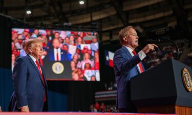 President Donald Trump listens as Republican Senate candidate and Texas Attorney General Ken Paxton speaks during a campaign rally in San Antonio