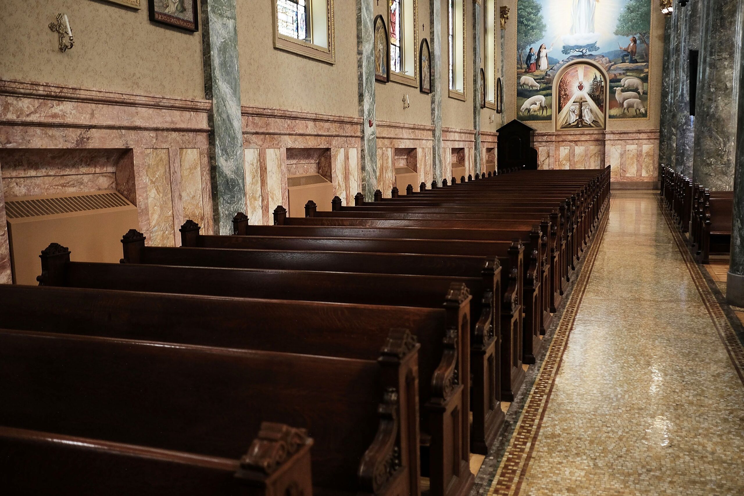 <i>Mario Tama/Getty Images via CNN Newsource</i><br/>A worshipper kneels in St. Paul's Chapel
