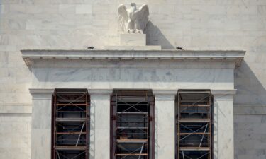 A marble American eagle sculpture sits atop of the Marriner S. Eccles Federal Reserve Board Building in Washington