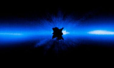 An artist’s interpretation depicts Beta Pictoris b (right) as it orbits its host star. The giant exoplanet was the source of a recently detected radio signal.