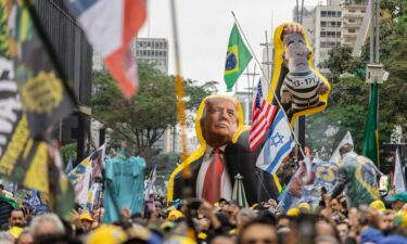 Brazilian President Luiz Inacio Lula da Silva waves to supporters during a presidential election campaign rally in São Bernardo do Campo