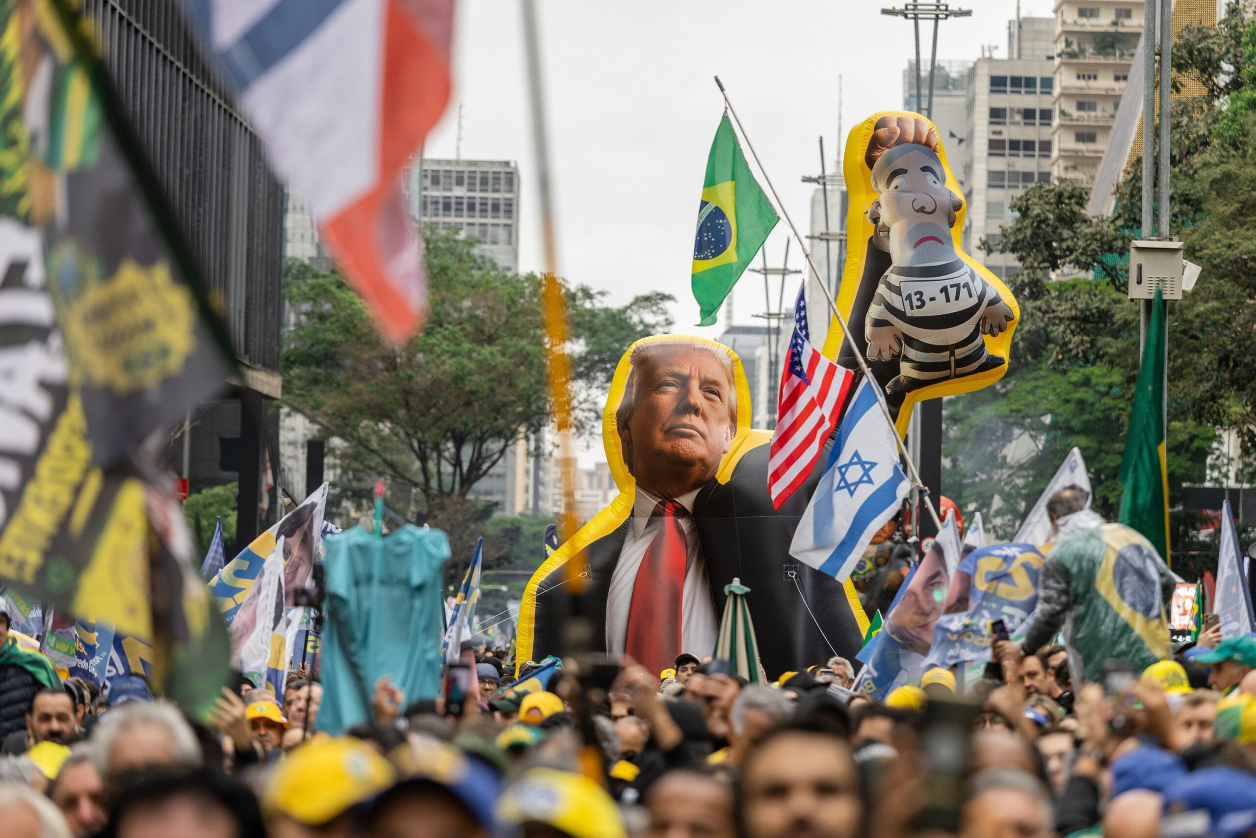 <i>Andre Penner/AP via CNN Newsource</i><br/>Brazilian President Luiz Inacio Lula da Silva waves to supporters during a presidential election campaign rally in São Bernardo do Campo