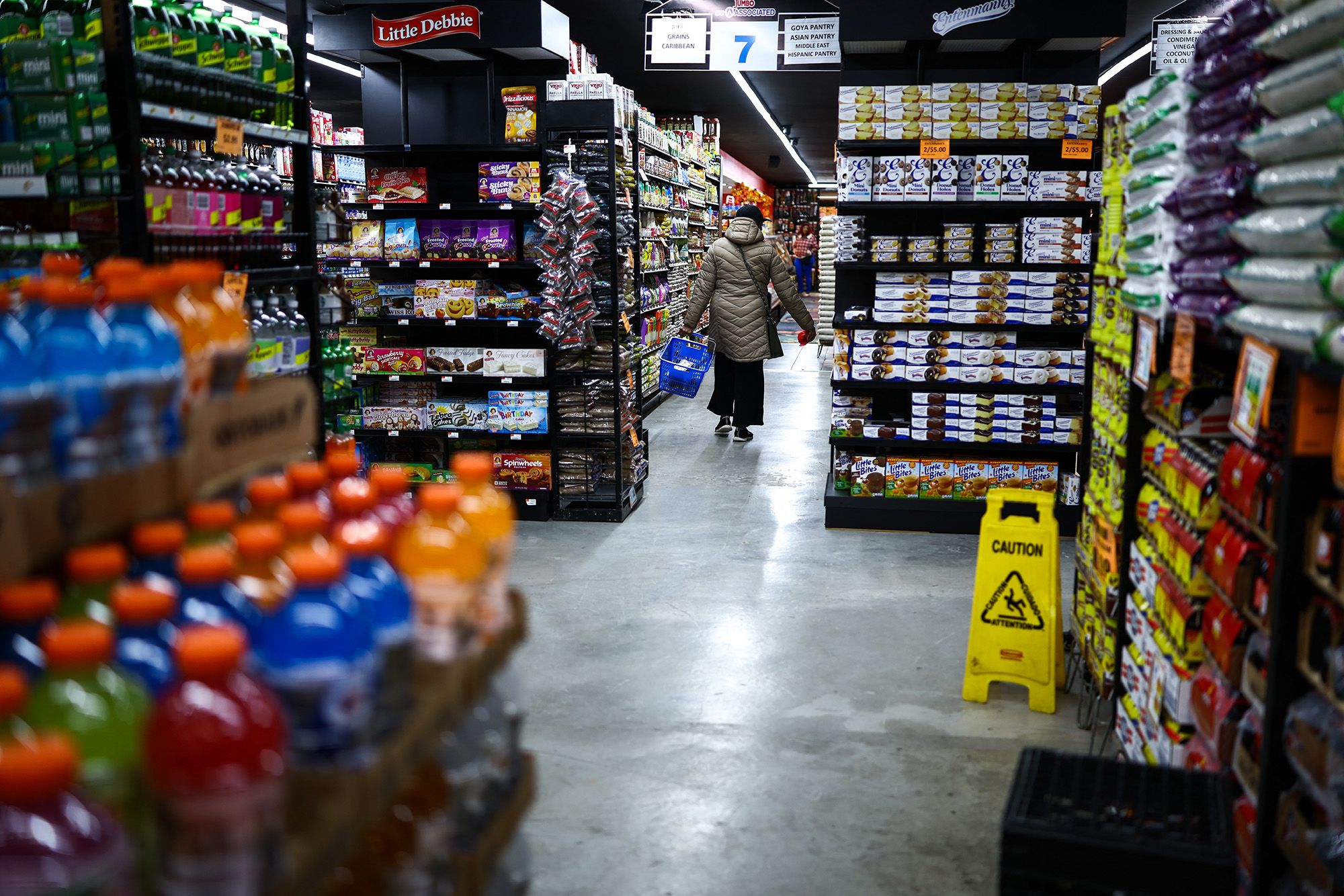 <i>Charly Triballeau/AFP/Getty Images via CNN Newsource</i><br/>A customer walks down the aisle in a supermarket in the Sugar Hill neighborhood of Manhattan in New York on September 28