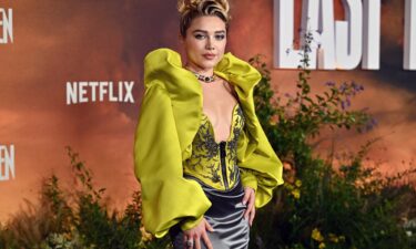 A Dior brocade jacket worn as as a mini dress at a photocall for "East of Eden" in London