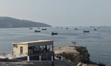 An aerial view shows ships anchored off the coast of Khasab in Oman's Musandam Governorate