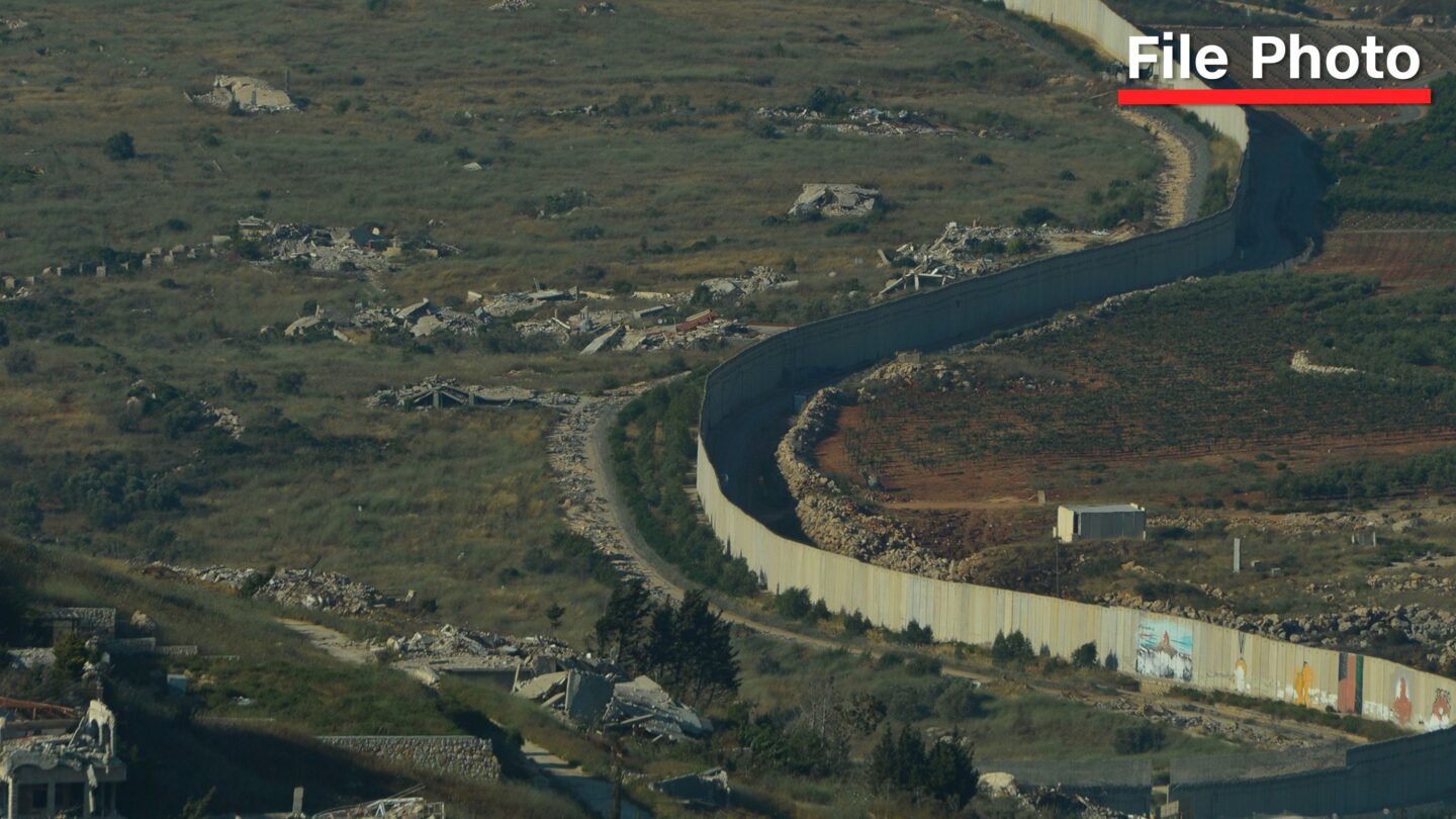 <i>Martin Grimes/Getty Images via CNN Newsource</i><br/>A border wall erected by Israel along its northern border with Lebanon is seen between Metulla in Israel to the right and Odaisseh in Lebanon to the left on June 19.